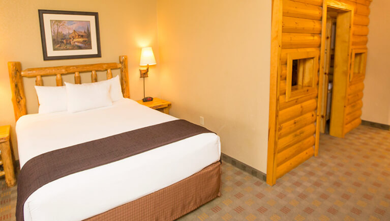 The bed and indoor cabin with bunk beds in the accessible KidCabin Suite